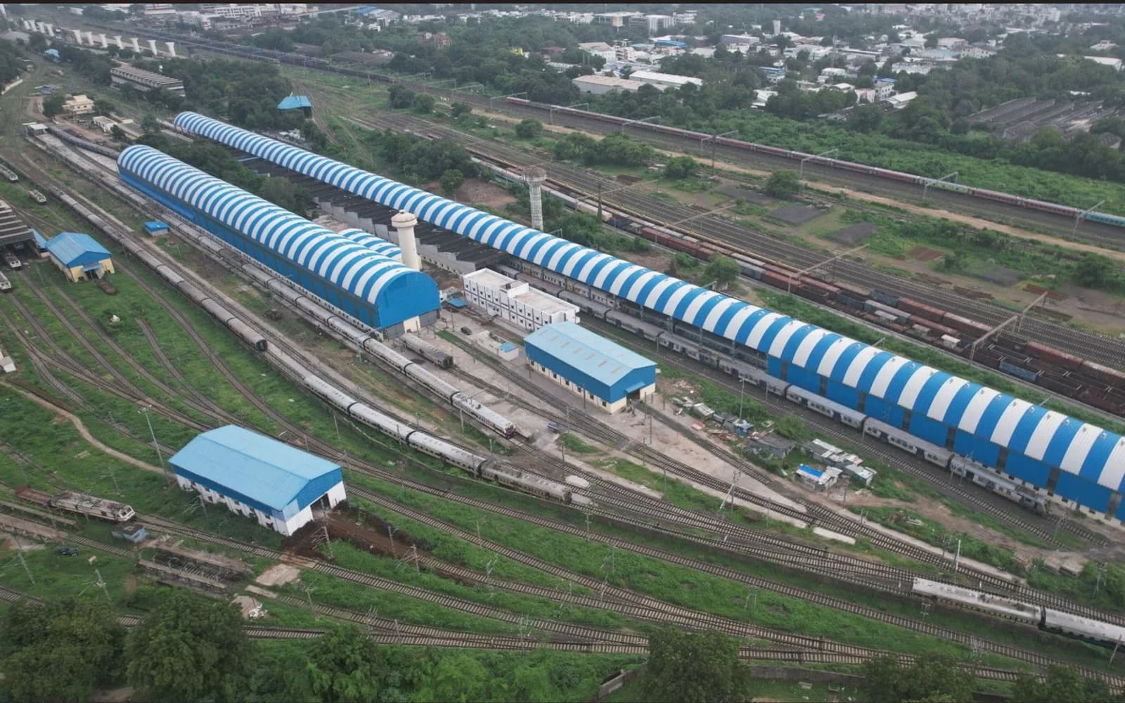 Aerial view of the MEMU car shed facility and rail lines in Vadodara.